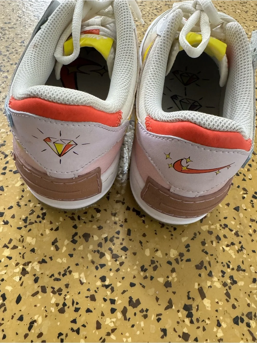 Nike Kids White Sneakers with Pink, Orange and Yellow Accents